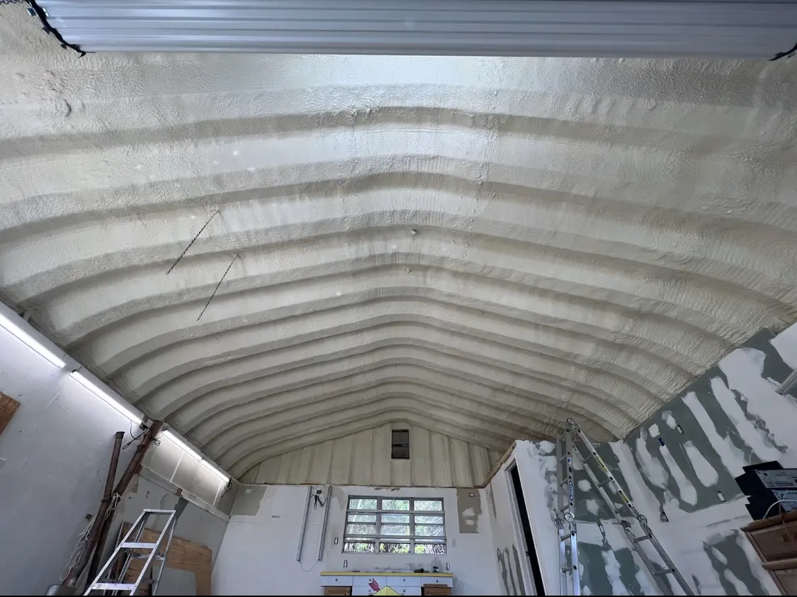 Spray polyurethane foam applied to the underside of a metal roof deck in Murphy